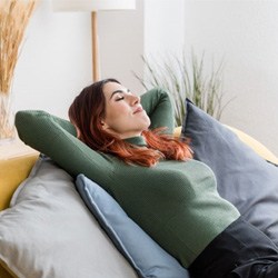 Woman resting peacefully on sofa