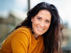 Portrait of happy middle-aged woman with beautiful teeth