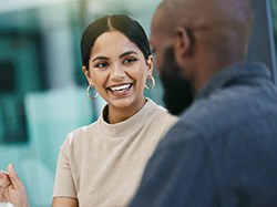 Smiling, confident woman in business setting