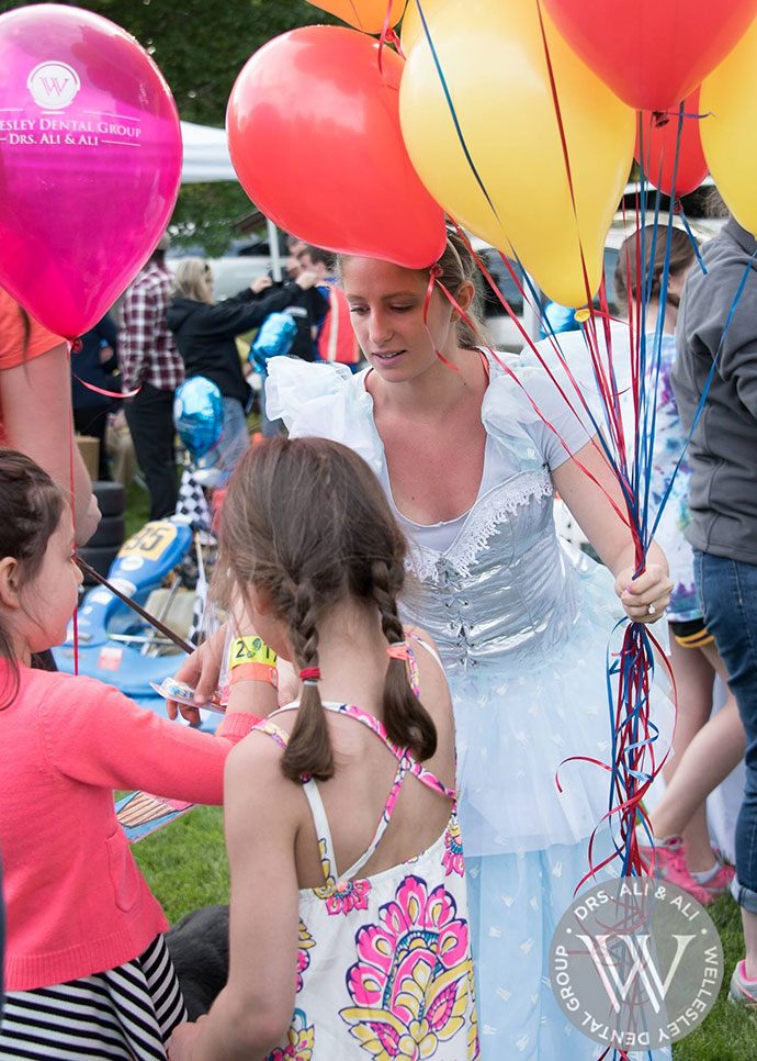 Dental team member in tooth fairy costume at community event