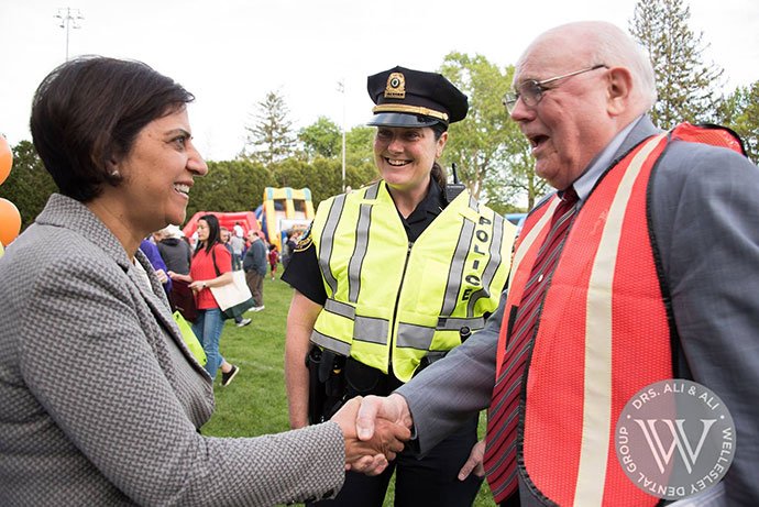 Dentist shaking hands with community leader