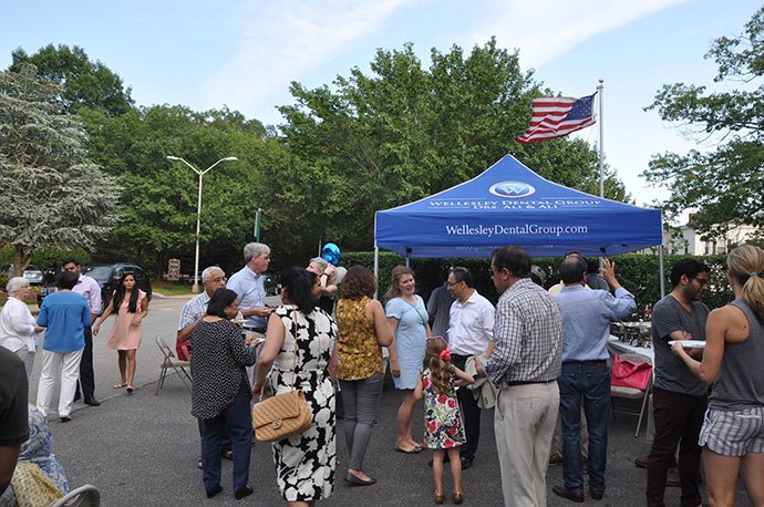 Group of people at Wellesley Dental Group booth