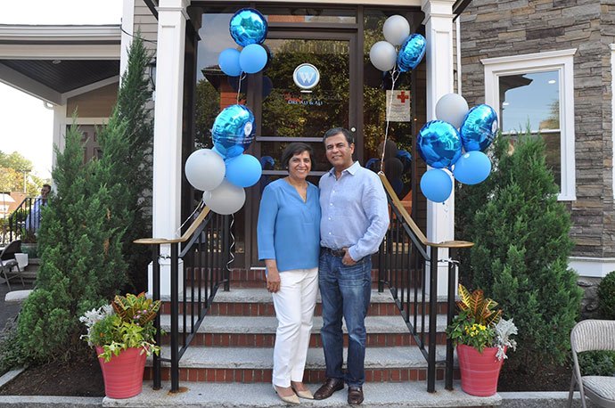 Dentists on dental office front steps