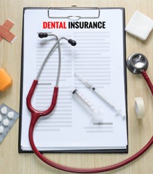 Dental insurance form on clipboard