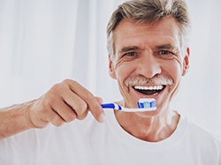 Closeup of dentists working on a patient getting dental implants in Wellesley 