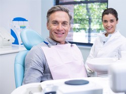 Male dental patient in treatment chair