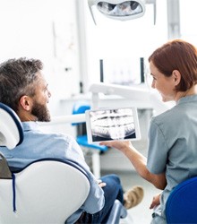 Wellesley dentist and patient in chair discussing dental X-rays and diabetes