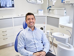Smiling male patient in treatment chair