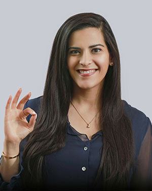 Dr. Zarah Ali smiling and giving the okay sign