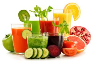 Variety of juices arranged against white background