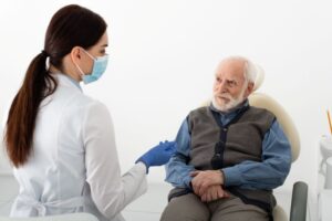 Senior patient having a serious conversation with his dentist