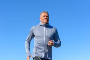 Mature man jogging outdoors